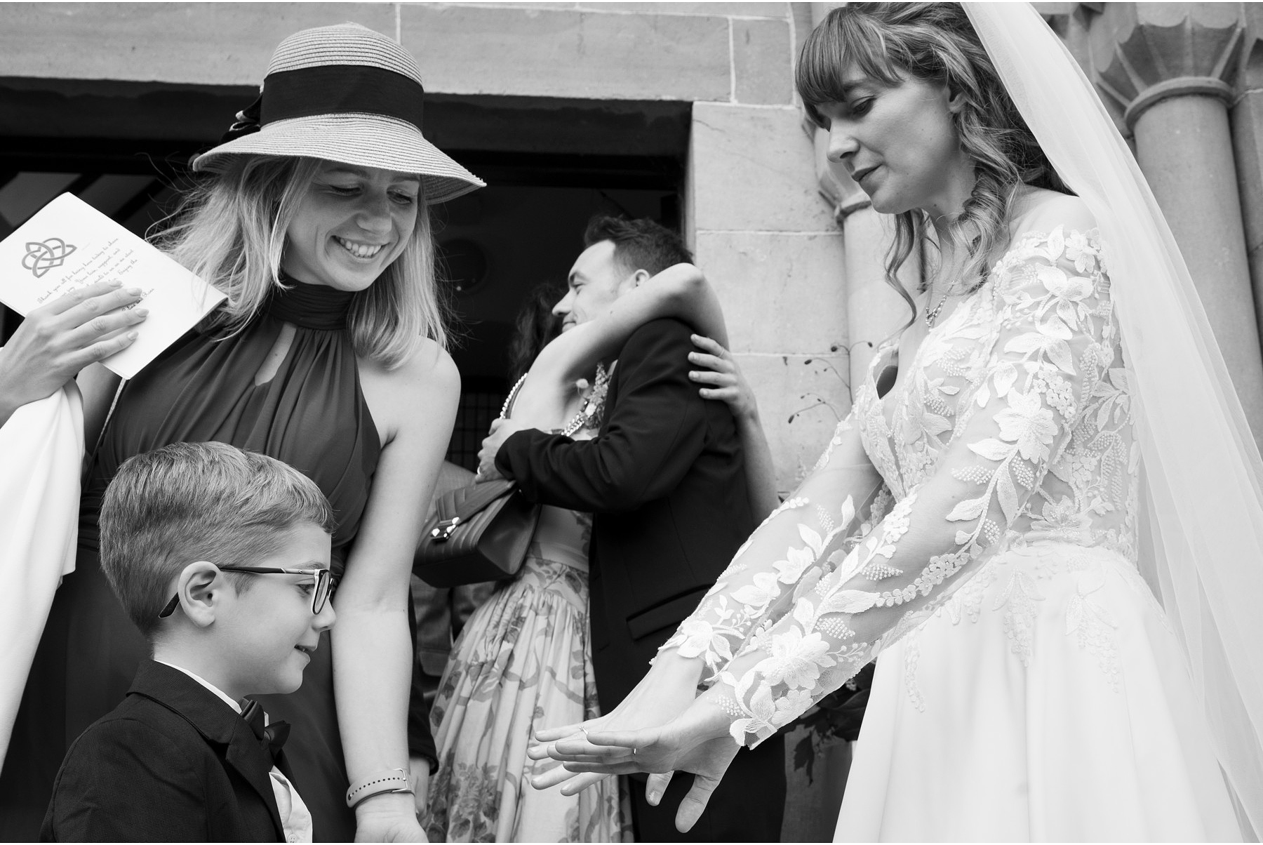 bride shows off her new wedding ring outside Kilrush church