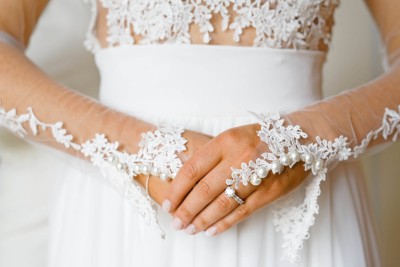 bride clasps her hands together while getting ready before her Ballymaloe wedding