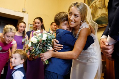 hugs for the bride from a little boy at East Cork wedding
