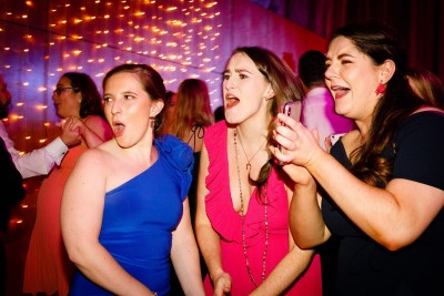 brides friends cheer her on at the wedding party in Castlemartyr