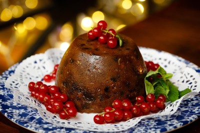 Christmas pudding photographed with berries and twinkling lights for The Farmgate Cafe, Cork City