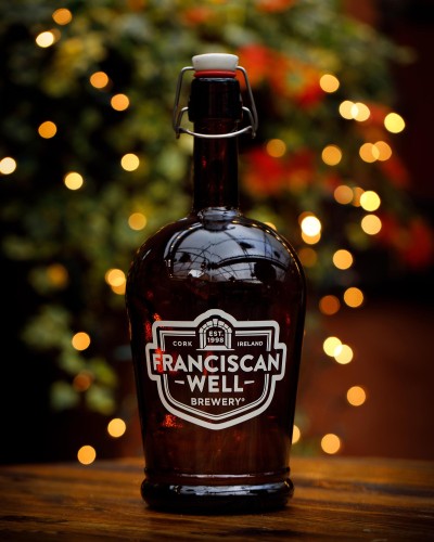 Franciscan Well growler against a festive background