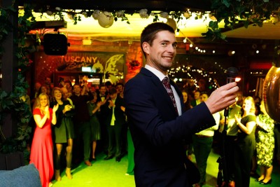 groom makes funny face at wedding photographer after his wedding speech at his wedding in Limerick