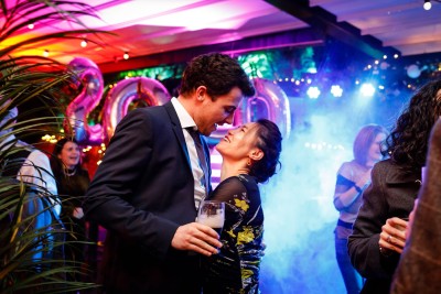 couple embrace at a party for NYE 2020