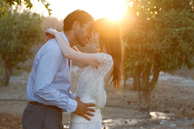 bride and groom embrace in the sunset at their destination wedding in Malaga Finca al Limon