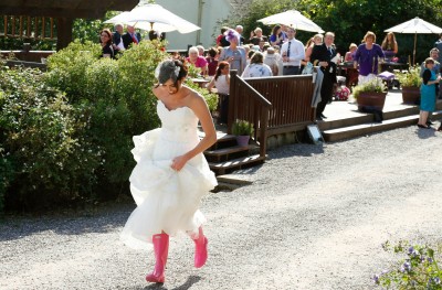 bride walks around Barnabrow in her pink wellies