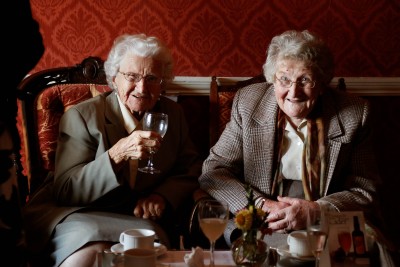 two little old ladies enjoy the wedding reception at Longueville House
