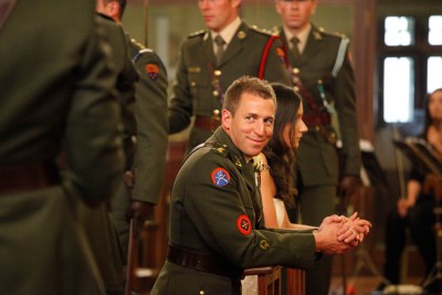 groom smiles at his fellow soldier at this military wedding in Cork