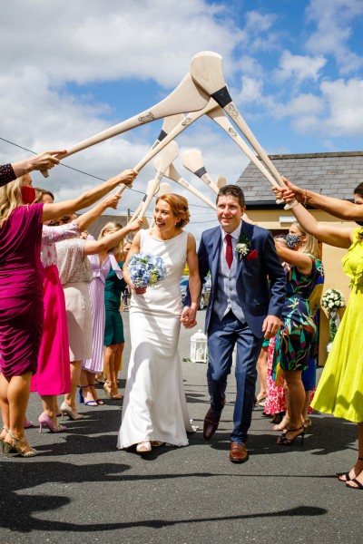 Irish wedding tradition for GAA players is to form an arch with hurleys or footballs.