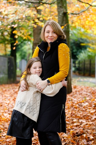 Daughter hugs her mum during their family photography shoot in Cork