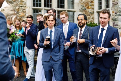 wedding guests enjoy drinks at reception in Waterford Castle