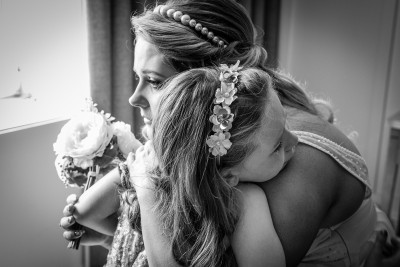 bride hugs her crying daughter